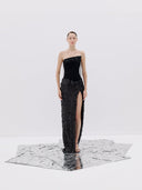 A Black Strapless Gown with a High Slit and Textured Skirt